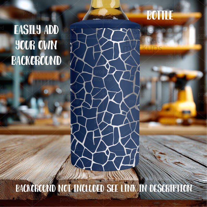 May include: A navy blue bottle cooler with a silver geometric pattern. The cooler is designed to fit around a bottle and keep it cold. The text on the cooler says "Bottle".