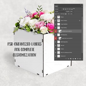 May include: A white, geometric box mockup filled with a vibrant floral arrangement of pink, white, and green flowers. The text "PSD ORGANIZED LAYERS FOR COMPLETE CUSTOMIZATION" is displayed on the box. A digital interface panel is visible on the right.