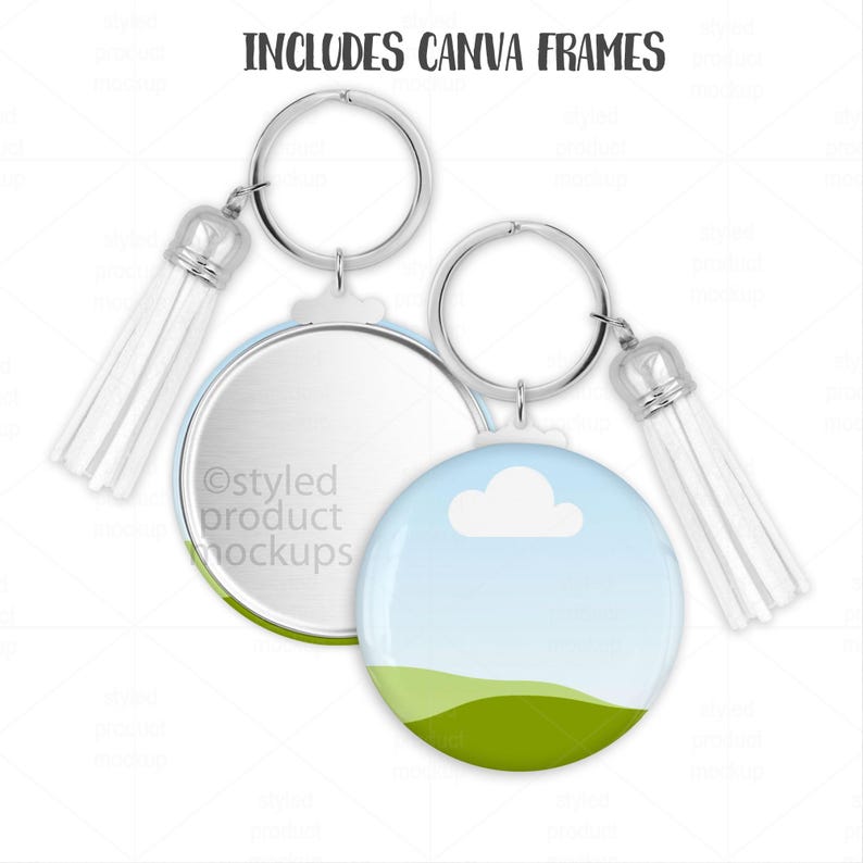 May include: Two round keychains with silver rings and white tassels. One keychain features a blue sky and green landscape design, the other has a blank silver surface. The text "INCLUDES CANVA FRAMES" is at the top.