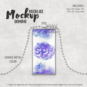 May include: A silver necklace mockup with a rectangular pendant featuring a purple and blue watercolor design. The pendant has a silver frame and the text "SPM" is visible in the center. The necklace is on a white background.