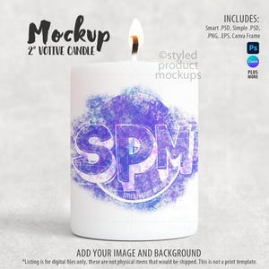 May include: A white 2-inch votive candle with a lit wick. The candle features a purple and blue design with the letters "SPM" and the text "Styled Product Mockups". The image includes the text "Mockup" and "Add your image and background".