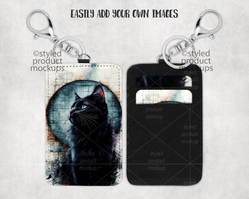 May include: Two black leather keychains with a silver metal ring. One keychain has a black cat with blue eyes on a white background. The other keychain has a black background with a white card holder.