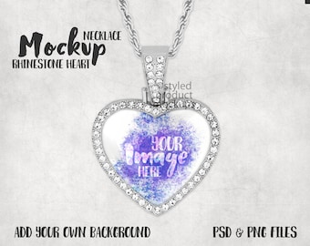 May include: Silver necklace with a heart-shaped pendant. The pendant is decorated with rhinestones and has a clear glass insert that says "YOUR IMAGE HERE".