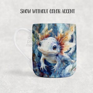 May include: White ceramic mug featuring a watercolor illustration of a blue axolotl with orange gills. The axolotl is set against a blue and green aquatic background. The mug has a curved handle and a white interior.