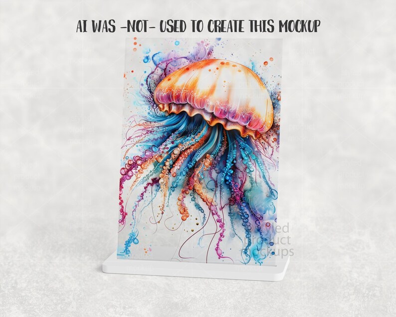 Puede incluir: Una impresi&oacute;n de acuarela de una medusa en colores vibrantes, incluyendo naranja, rosa, azul y morado. La medusa se muestra en un soporte blanco, con el texto "AI WAS -NOT- USED TO CREATE THIS MOCKUP" en la parte superior.