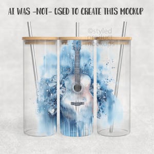 May include: Clear glass tumbler with a bamboo lid and a stainless steel straw. The tumbler features a watercolor design of an acoustic guitar with blue floral accents and the text "AI WAS -NOT- USED TO CREATE THIS MOCKUP".