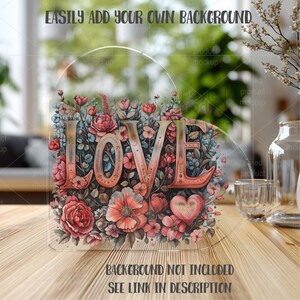 May include: A clear, heart-shaped acrylic sign with the word "LOVE" in a coral-colored, vintage font. The sign is filled with a floral arrangement of red, pink, and blue flowers. Text at the top reads "EASILY ADD YOUR OWN BACKGROUND" and at the bottom "BACKGROUND NOT INCLUDED SEE LINK IN DESCRIPTION".