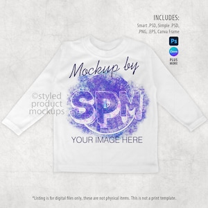 May include: White long-sleeve shirt with a purple and blue graphic design in the center. The graphic includes the letters "SPM" and the words "Mockup by" and "Your Image Here". The image also includes text that says "Includes: Smart .PSD, Simple .PSD, PNG, EPS, Canva Frame".