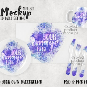 May include: A mockup of a kid's table setting with a white plate, a placemat, a mug, and a set of plastic cutlery. The items are decorated with a watercolor-style design in shades of blue and purple. The text "YOUR IMAGE HERE" is superimposed on each item.