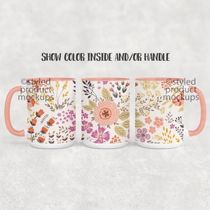 May include: Three white ceramic mugs with pink handles and a floral pattern. The mugs have a pink rim and a floral design with pink, orange, yellow, and green colors. The text "Show Color Inside and/or Handle" is displayed above the mugs.