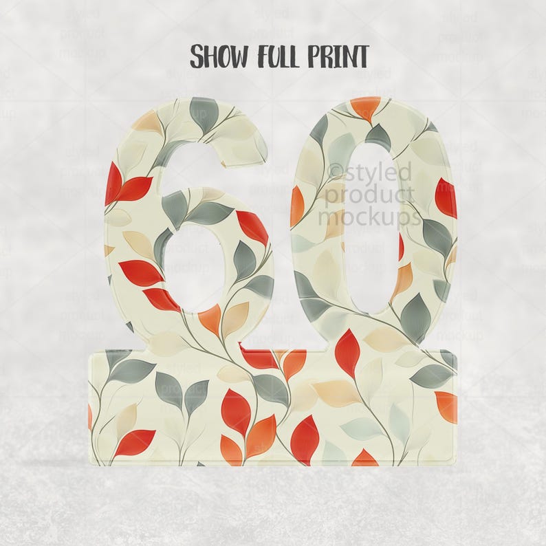 Op de afbeelding: Een decoratief nummer 60, met een bloemmotief van rode, oranje en grijze bladeren op een cr&egrave;mekleurige achtergrond. De tekst "SHOW FULL PRINT" staat bovenaan. Geschikt voor een verjaardag of jubileum.