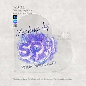 May include: A clear, heart-shaped product mockup with the text "Mockup by SPM" in a purple and white design. The words "YOUR IMAGE HERE" are at the bottom. Includes Smart .PSD, Simple .PSD, .PNG, .EPS, and Canva Frame.