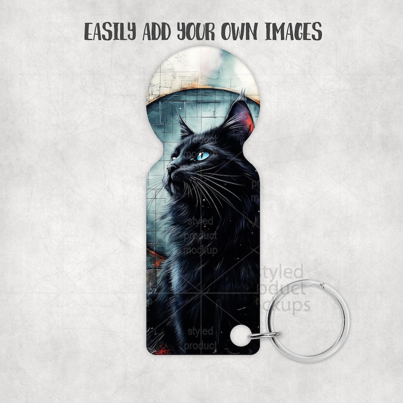May include: Keyring featuring a black cat with blue eyes, set against a cityscape backdrop. The cat is the focal point, with detailed fur and a contemplative gaze. The keyring has a silver-colored ring and a white attachment. The text "EASILY ADD YOUR OWN IMAGES" is at the top.