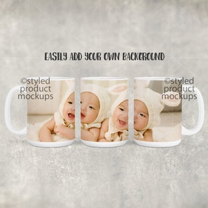 May include: Three white ceramic mugs with a photo of two babies wearing white bunny hats. The mugs are arranged in a row, with the babies' faces visible in each mug. The text "@styled product mockups" is visible on the left and right mugs.