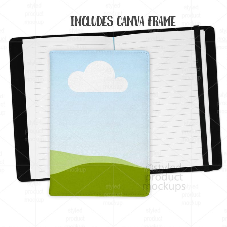 May include: A black notebook with lined pages, open to display a smaller notebook with a sky and cloud design. The smaller notebook is light blue with a green landscape at the bottom. The text "INCLUDES CANVA FRAME" is at the top.