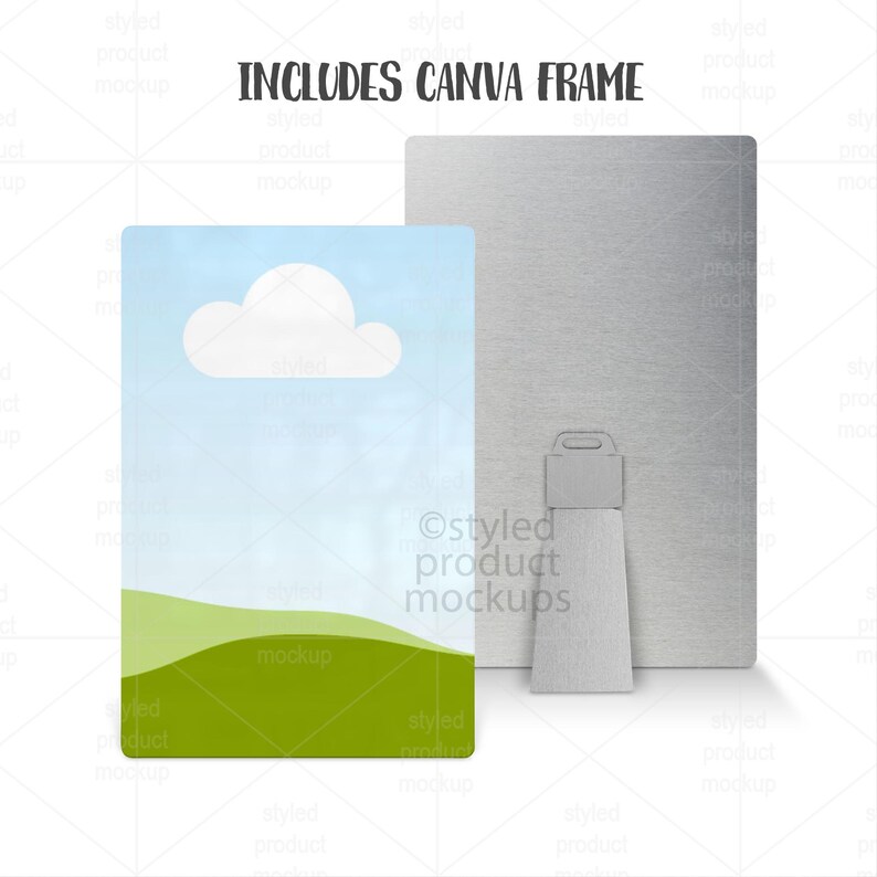 Puede incluir: Una maqueta de marco de lienzo rectangular con un dise&ntilde;o de paisaje que presenta un cielo azul, una nube blanca y colinas verdes. El texto "INCLUDES CANVA FRAME" est&aacute; en la parte superior. Un panel trasero plateado con un soporte est&aacute; detr&aacute;s del lienzo.