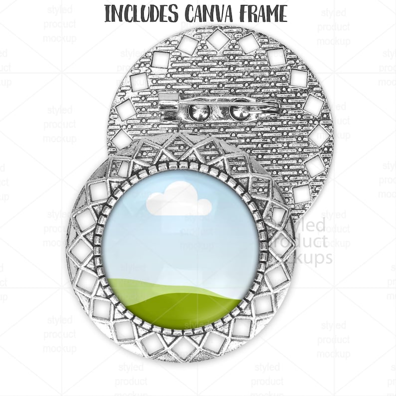 May include: Silver-toned metal brooch with an oval frame featuring a landscape scene of a blue sky, white cloud, and green field. The brooch has a decorative geometric pattern and the text "INCLUDES CANVA FRAME".