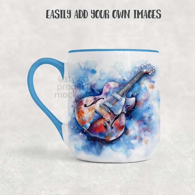 May include: White ceramic mug with a blue handle and rim. The mug features a watercolor painting of a guitar in shades of blue, orange, and brown. The text "EASILY ADD YOUR OWN IMAGES" is printed at the top.