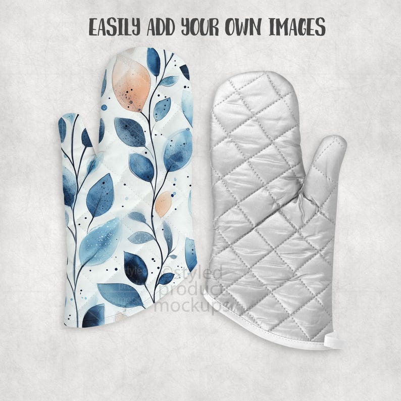May include: Two oven mitts. One features a watercolor design of blue leaves and peach-colored accents on a white background. The other is a quilted, solid white oven mitt. The text "EASILY ADD YOUR OWN IMAGES" is at the top.