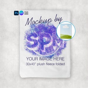 May include: White plush fleece blanket mockup, folded, with the text "Mockup by SPM" and "YOUR IMAGE HERE". The blanket measures 30x40 inches. A small image shows a landscape scene. The design includes a purple and blue splash effect.