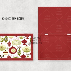 May include: A red box with an open lid, showing the inside. The box on the left has a lid with a white background and a pattern of green, red, and white Christmas ornaments. The text "CHANGE BOX COLOR" is at the top.