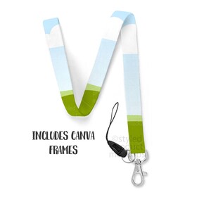 May include: A lanyard with a landscape design featuring blue sky, green fields, and white clouds. The lanyard has a black cord, a silver-colored metal clasp, and the text "INCLUDES CANVA FRAMES".