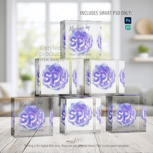 Puede incluir: Una pila de bloques acrílicos transparentes con un diseño morado y blanco. Cada bloque tiene el texto "Mockup by SPM" y "YOUR IMAGE HERE". La imagen también incluye el texto "INCLUDES SMART PSD ONLY:" y los iconos de Photoshop y Procreate.