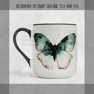 May include: White ceramic mug with a black handle and rim. The mug features a watercolor-style butterfly design in shades of teal, green, and white. The mug is designed to crop square, 5:4 and 4:5.