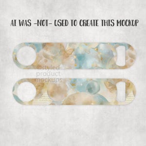 May include: Two bottle openers with a watercolor design featuring butterflies, gold accents, and a blue and beige color scheme. The text "AI WAS -NOT- USED TO CREATE THIS MOCKUP" is at the top.