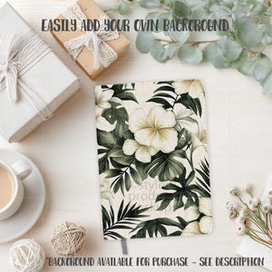 May include: A notebook with a floral design featuring white hibiscus flowers and green leaves. The notebook is open, revealing a gray ribbon bookmark. The text "EASILY ADD YOUR OWN BACKGROUND" is at the top. The text "BACKGROUND AVAILABLE FOR PURCHASE - SEE DESCRIPTION" is at the bottom.