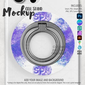 May include: A white cell phone mockup with a purple and white cell phone ring holder. The ring holder has the text "SPM" on it. The mockup is on a white background.