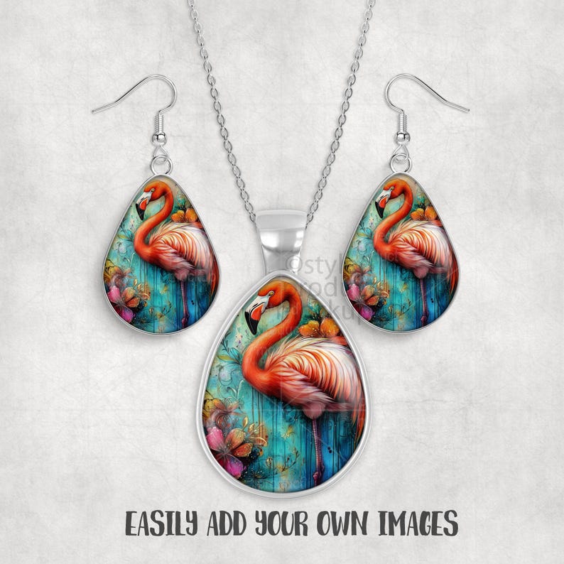May include: A silver-toned jewelry set featuring a flamingo design. The set includes a pendant necklace and matching teardrop earrings. The flamingo is depicted in shades of orange and pink against a teal background with floral accents. The text "EASILY ADD YOUR OWN IMAGES" is at the bottom.