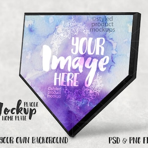 May include: A purple and blue watercolor home plate plaque mockup with a black frame. The plaque has a floral design and the text "YOUR Image HERE".