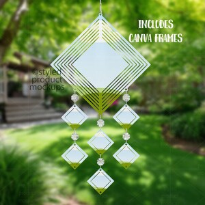 May include: A decorative wind chime with a geometric design. It features diamond-shaped elements and clear crystal beads. The wind chime is suspended from a metal hook and includes the text "INCLUDES CANVA FRAMES".