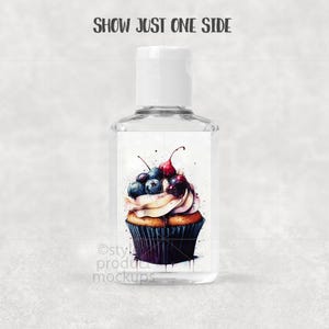 May include: Clear hand sanitizer bottle with a white cap. The label features a watercolor cupcake design topped with blueberries and cherries. Text on the top reads "SHOW JUST ONE SIDE". The bottom of the label has the text "Osty! product mockups".