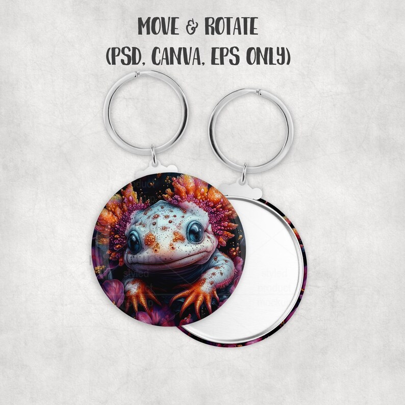 May include: Round keychain featuring a cartoon axolotl with a white and blue body, orange gills, and orange feet. The axolotl is surrounded by pink flowers. The keychain has a silver ring and the text "MOVE & ROTATE (PSD. CANVA. EPS ONLY)".