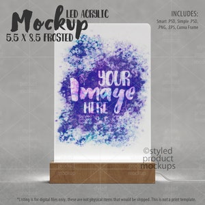 May include: A mockup of a frosted acrylic sign with a wooden base. The sign is 5.5 inches by 8.5 inches and has a watercolor-style design with purple, blue, and pink colors. The text "Your Image Here" is written on the sign.