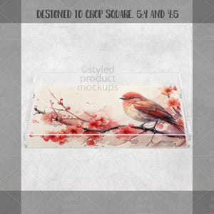 May include: A clear acrylic tray with a watercolor design featuring a bird perched on a flowering branch with red blossoms. The tray has a rectangular shape with a decorative design. The text "DESIGNED TO CROP SQUARE. 5:4 AND 4:5" is at the top.