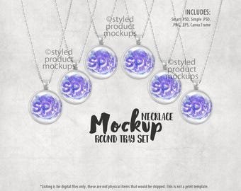 May include: Five silver necklaces with round, purple and white watercolour pendants. The pendants have the letters "SPM" in white. The necklaces are arranged in a circle on a grey background. The text "NECKLACE MOCKUP ROUND TRAY SET" is below the necklaces.