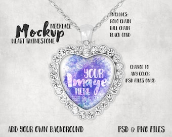 May include: A silver heart-shaped pendant necklace with a clear glass insert. The glass insert has a watercolour design in shades of purple and blue. The pendant is surrounded by clear rhinestones. The text "YOUR IMAGE HERE" is printed on the glass insert. The necklace is on a white background.