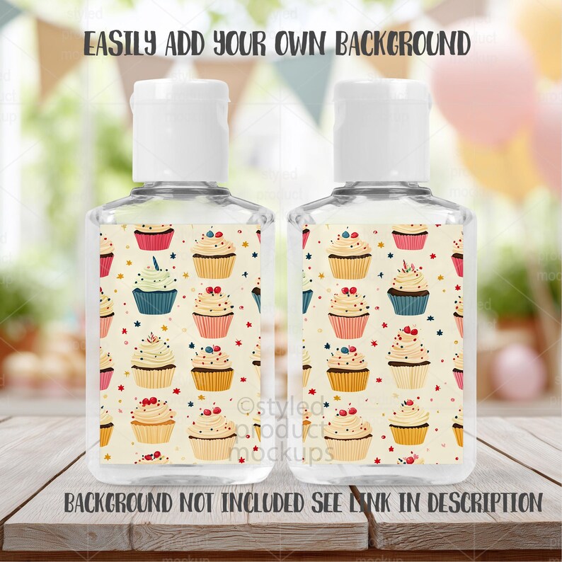 May include: Two clear hand sanitizer bottles with white caps. The labels feature a repeating pattern of colorful cupcakes on a cream background. Text at the top reads "EASILY ADD YOUR OWN BACKGROUND" and at the bottom "BACKGROUND NOT INCLUDED SEE LINK IN DESCRIPTION."