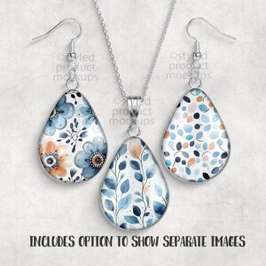May include: A silver-toned jewelry set featuring a teardrop pendant necklace and matching earrings. The pendants and earrings have a floral design with blue, orange, and white watercolor flowers and leaves. The text "INCLUDES OPTION TO SHOW SEPARATE IMAGES" is at the bottom.