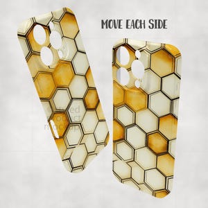 May include: Two phone cases with a honeycomb pattern in shades of cream and gold. The cases have cutouts for the camera and buttons. The text "MOVE EACH SIDE" is visible above the cases.