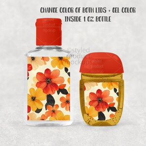 Op de afbeelding: Twee transparante flacons van 30 ml met rode deksels. E&eacute;n is rechthoekig, de andere is afgerond. Beide hebben een bloemenontwerp met oranje, rode en gele bloemen. De tekst op de flacons luidt "CHANGE COLOR OF BOTH LIDS + GEL COLOR INSIDE 1 OZ BOTTLE."