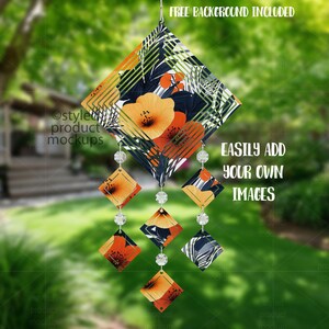 May include: A decorative wind chime with a floral and geometric design. The top section features orange flowers and a black background with white and yellow accents. The chime has diamond-shaped pendants with clear beads and the text "EASILY ADD YOUR OWN IMAGES".