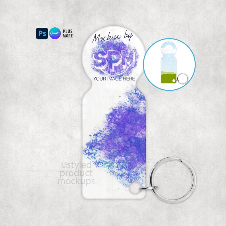 May include: A white keychain with a purple watercolor design. The keychain has a silver key ring and a circular top with the text "Mockup by SPM YOUR IMAGE HERE". The image also includes a small graphic of a keychain.