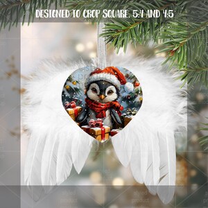 May include: Heart-shaped Christmas ornament featuring a penguin wearing a Santa hat and scarf, surrounded by gifts and snow. The ornament is framed by white feather wings and a silver ribbon. The text "DESIGNED TO CROP SQUARE, 5:4 AND 4:5" is at the top.