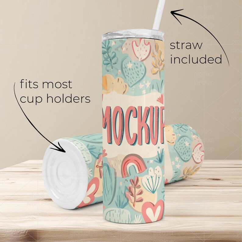 May include: A pair of insulated tumblers with a whimsical floral and heart pattern in pastel colors. One tumbler is upright with a straw, the other is lying down. Text on the tumbler reads "MOCKUP". The text "straw included" and "fits most cup holders" are also visible.