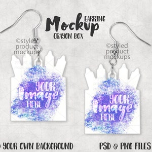 May include: Earring mockup featuring a white crayon box design with a purple and blue watercolor effect. The text "YOUR IMAGE HERE" is displayed on the front. The earrings have silver hooks and are designed for product mockups.