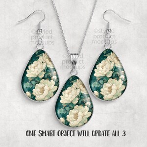 May include: A jewelry set featuring a pendant necklace and matching earrings. The teardrop-shaped pieces have a dark teal background with a floral pattern in cream and green. The text "ONE SMART OBJECT WILL UPDATE ALL 3" is at the bottom.